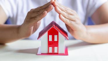 Representación de vivienda protegida con un seguro para casa